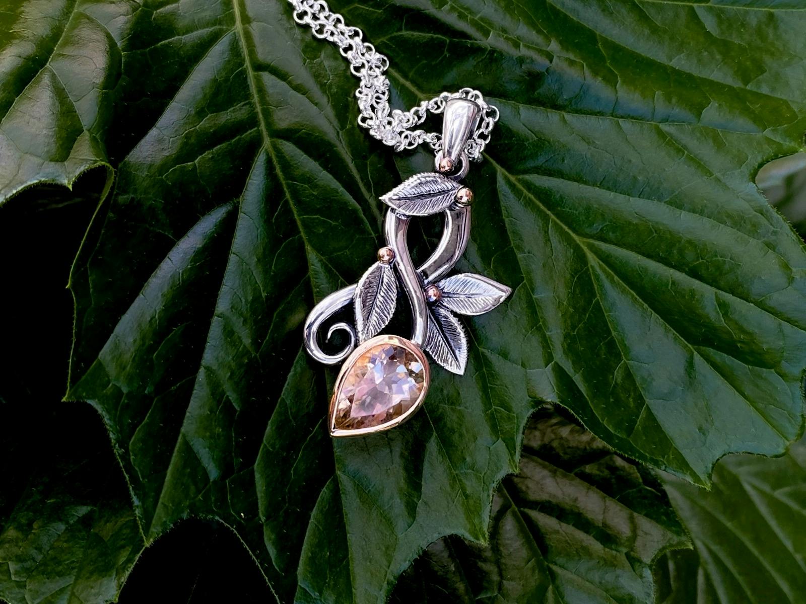 Pink gemstone necklace with silver floral embellishments