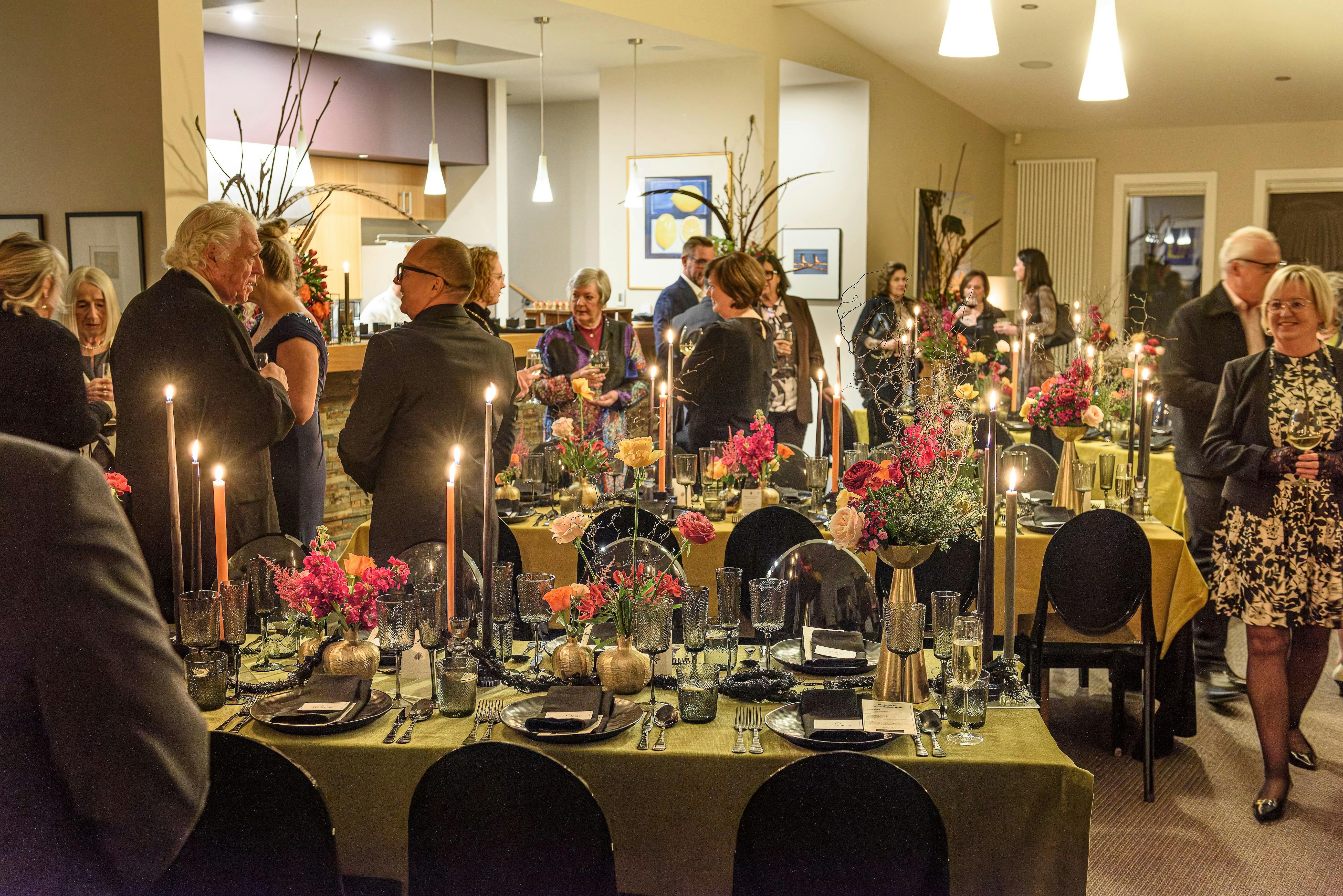 Table House guests mingling before dinner