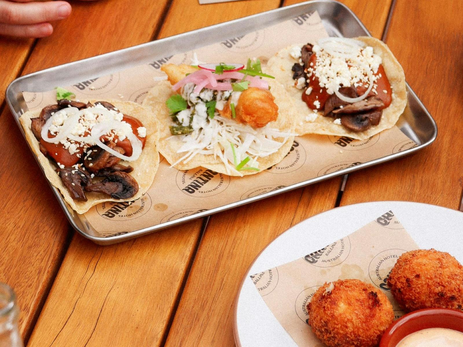 3 fresh tacos on table