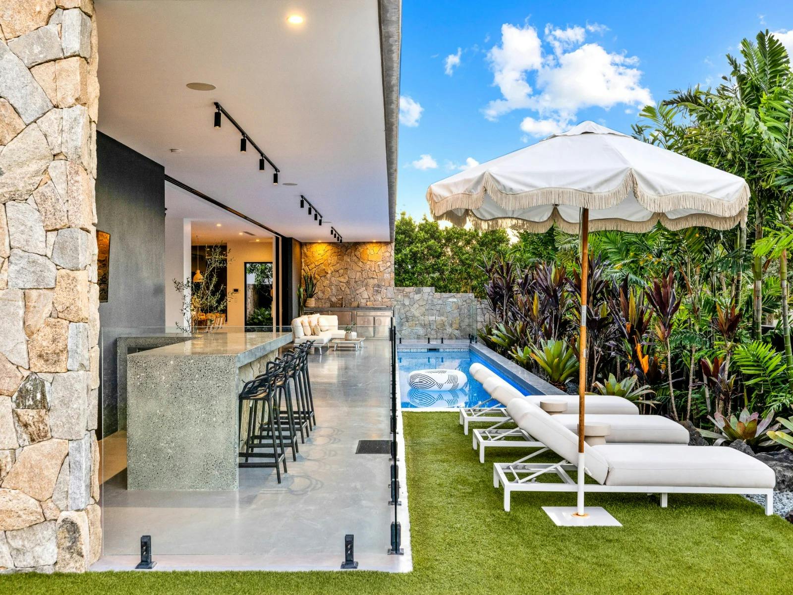 Relax on sun loungers by the heated pool (28°C), enjoying the sound of the waves