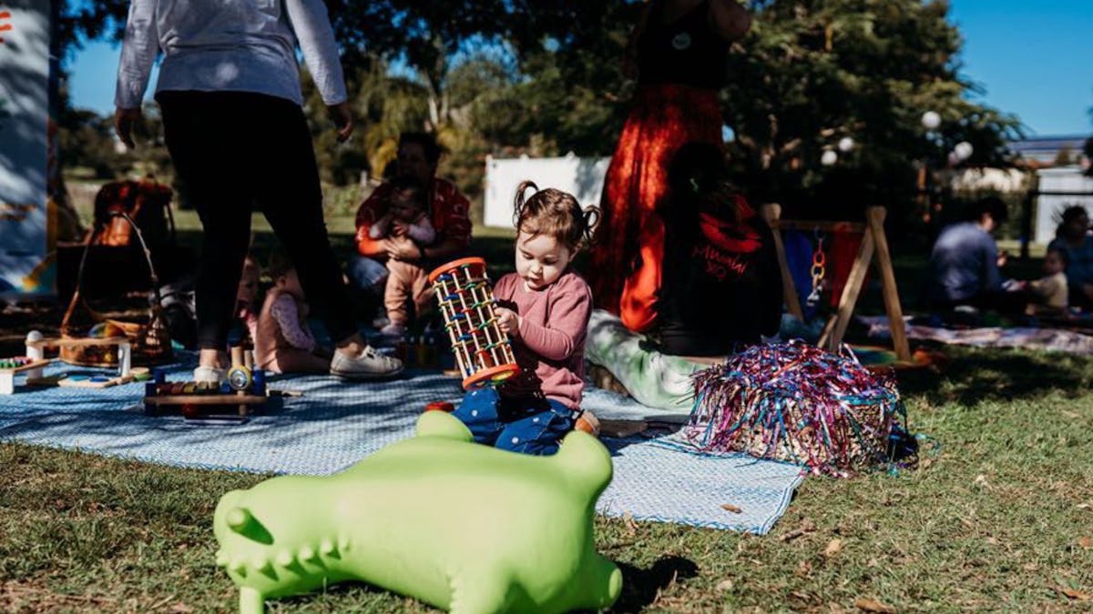Toy bounce dragon with girl playing in background