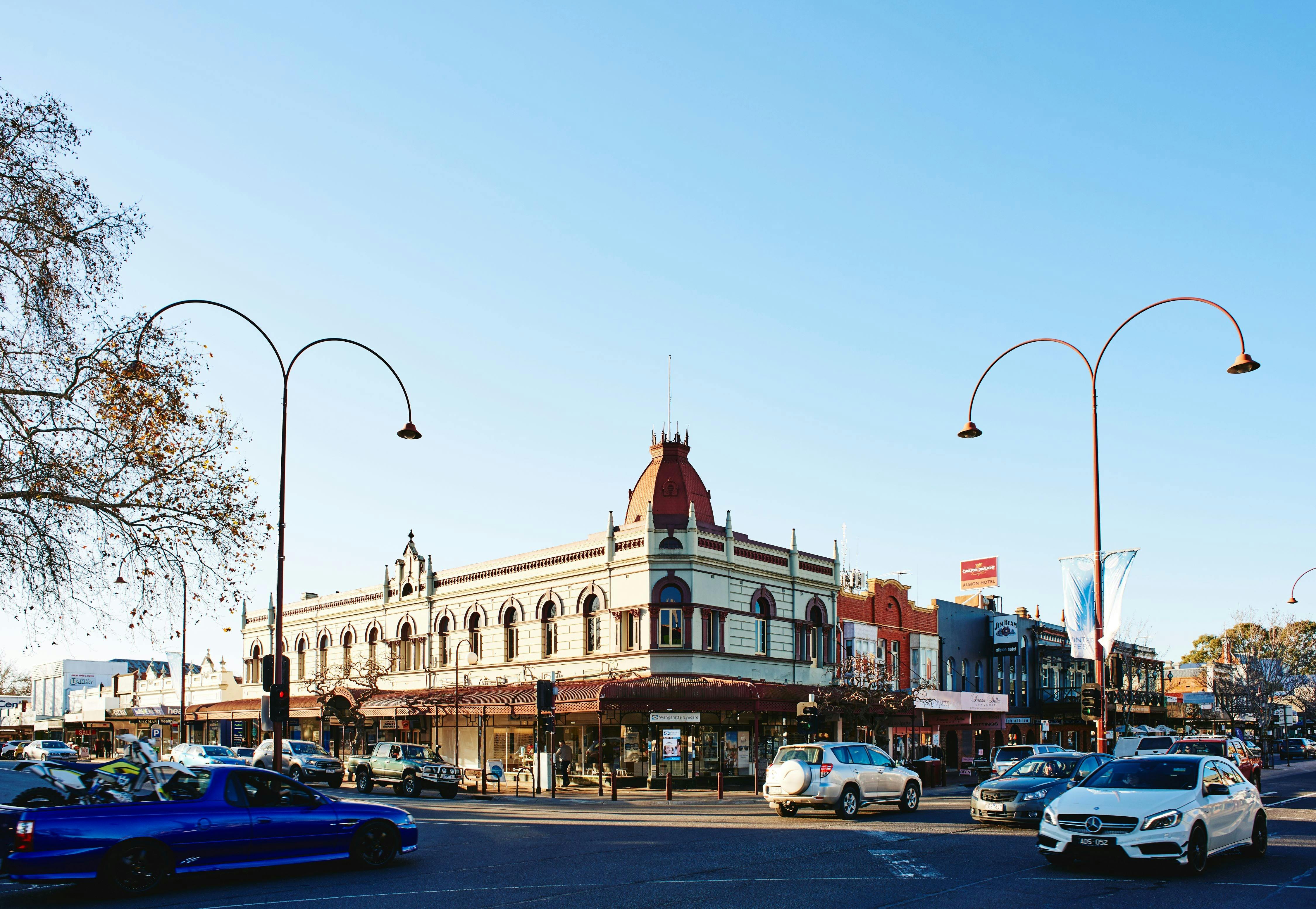 cars intersection historic corner building with verandahs