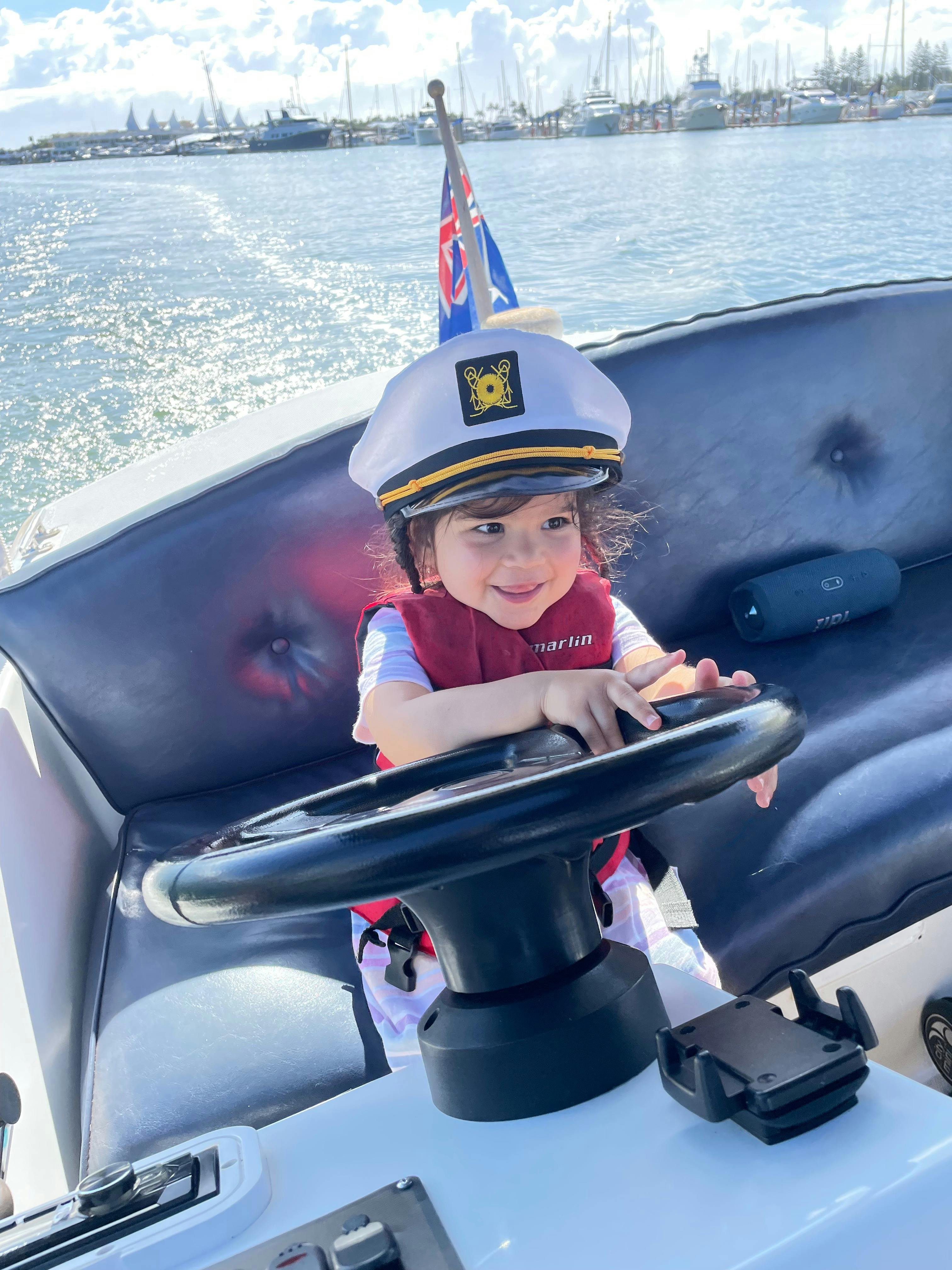 Duffy Boat Young Girl Captain at the Helm