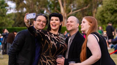 Group of people smiling to camera together