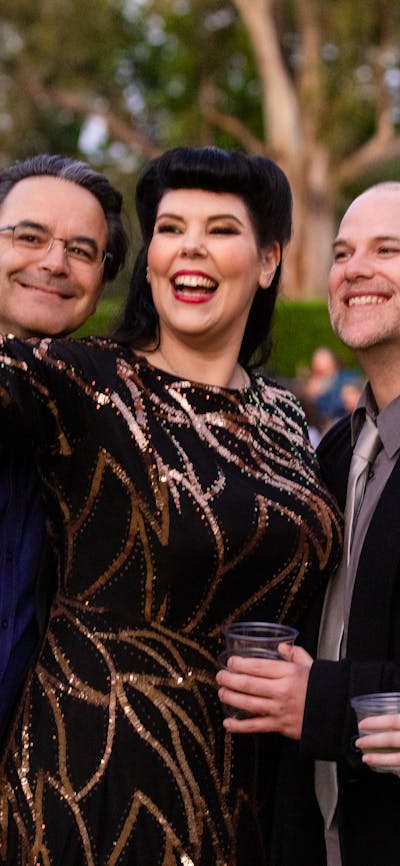 Group of people smiling to camera together