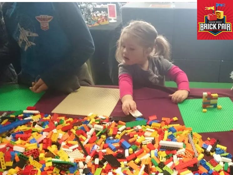 Young child playing with Lego