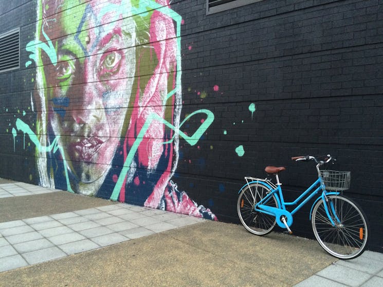 Discover Newcastle's street art on a bike with Newcastle Afoot's Local Experiences tour