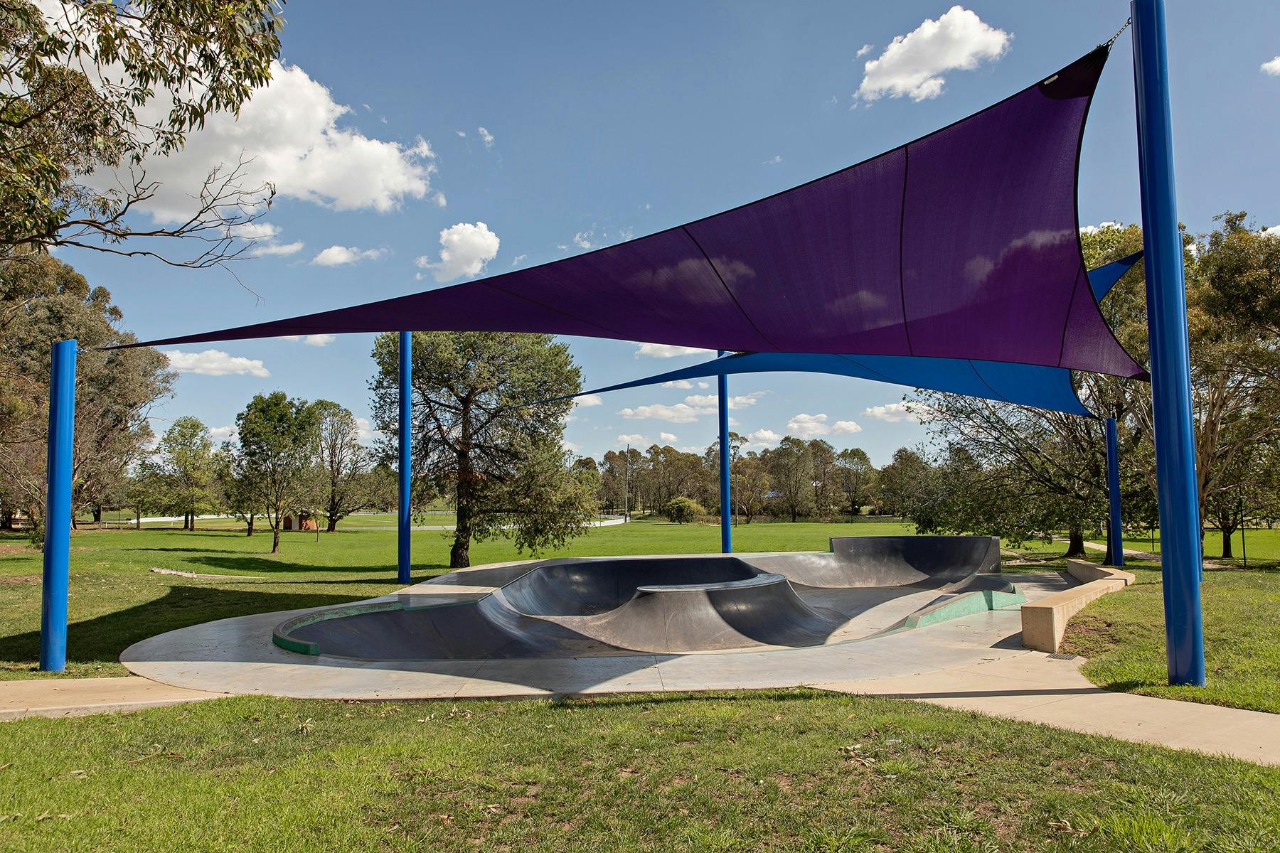Skate park with an interesting shaped bowl which has a volcano feature as a centrepiece.