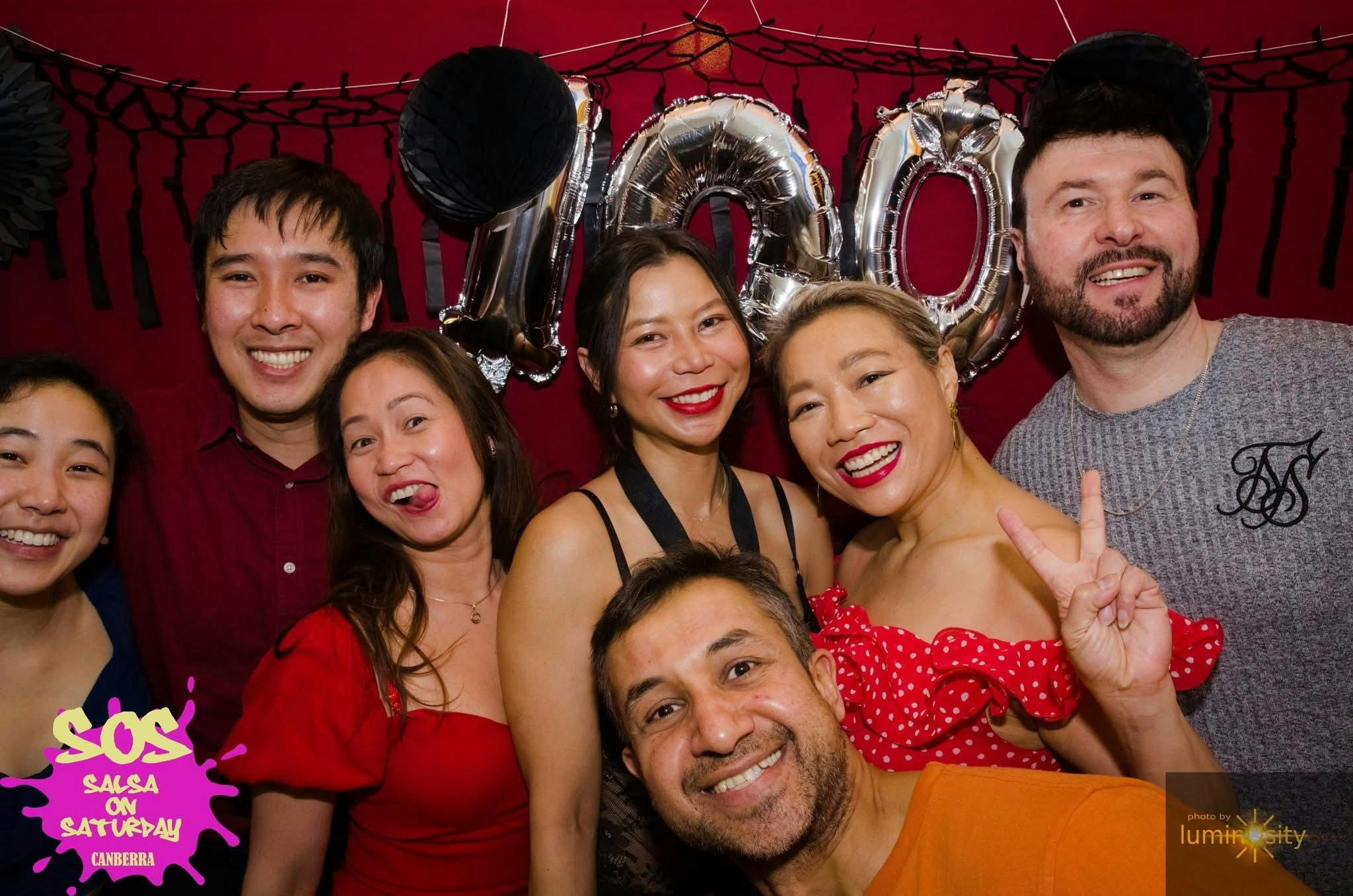 Group of people at the Photo Booth during SOS 100th event