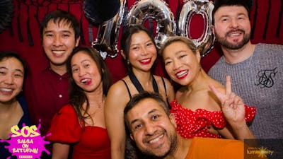 Group of people at the Photo Booth during SOS 100th event