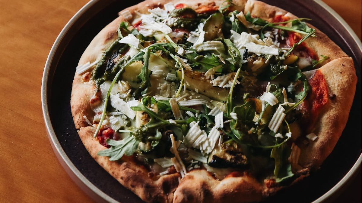 Enjoy stone baked pizza from shaved jamon serrano, grilled zucchini to truffled mushroom flavours.