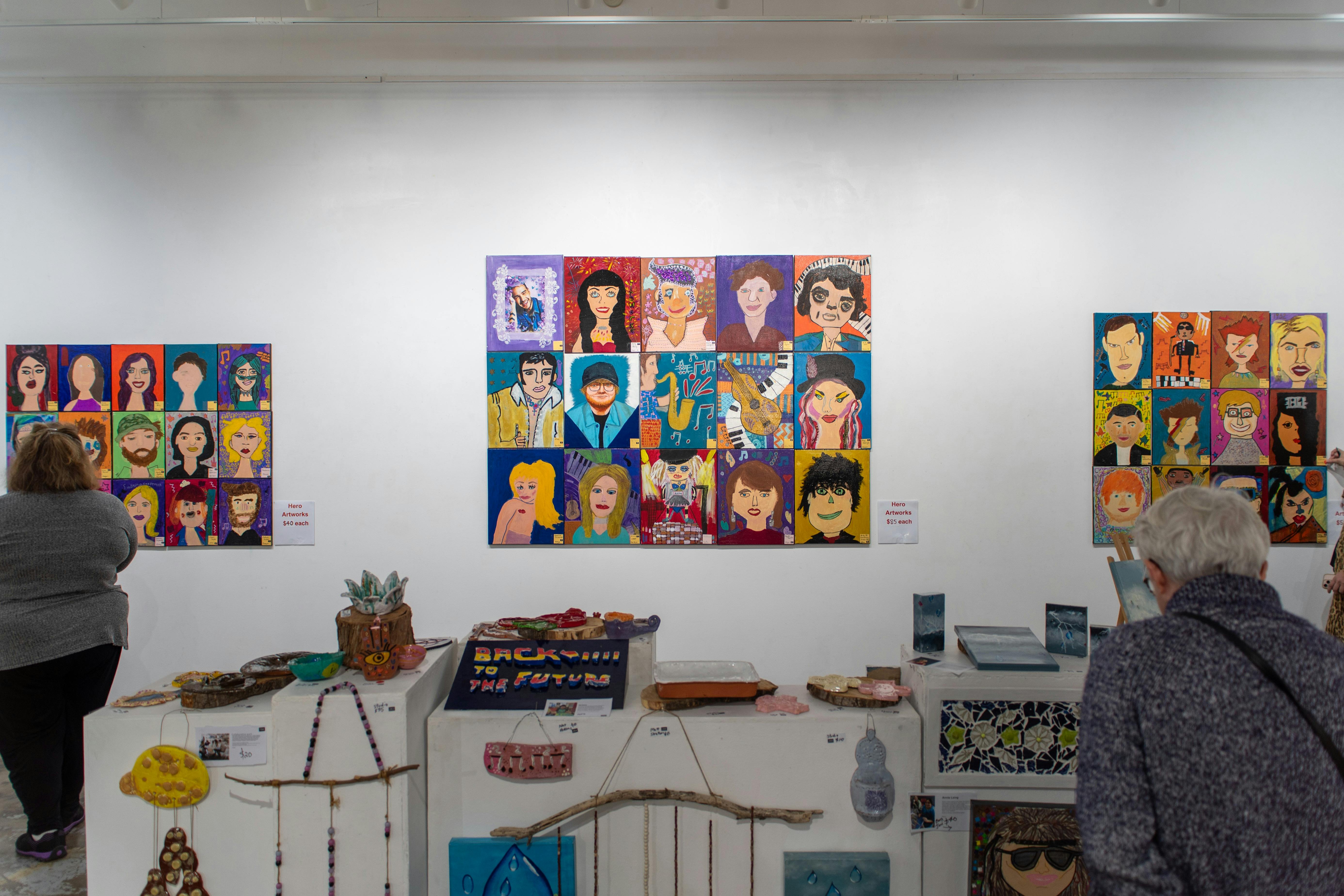 A wide angle view of different installations at an art gallery