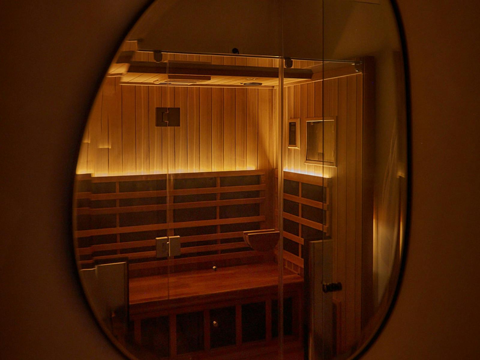 picture of an infrared sauna for two people, picture is taken looking through a mirror