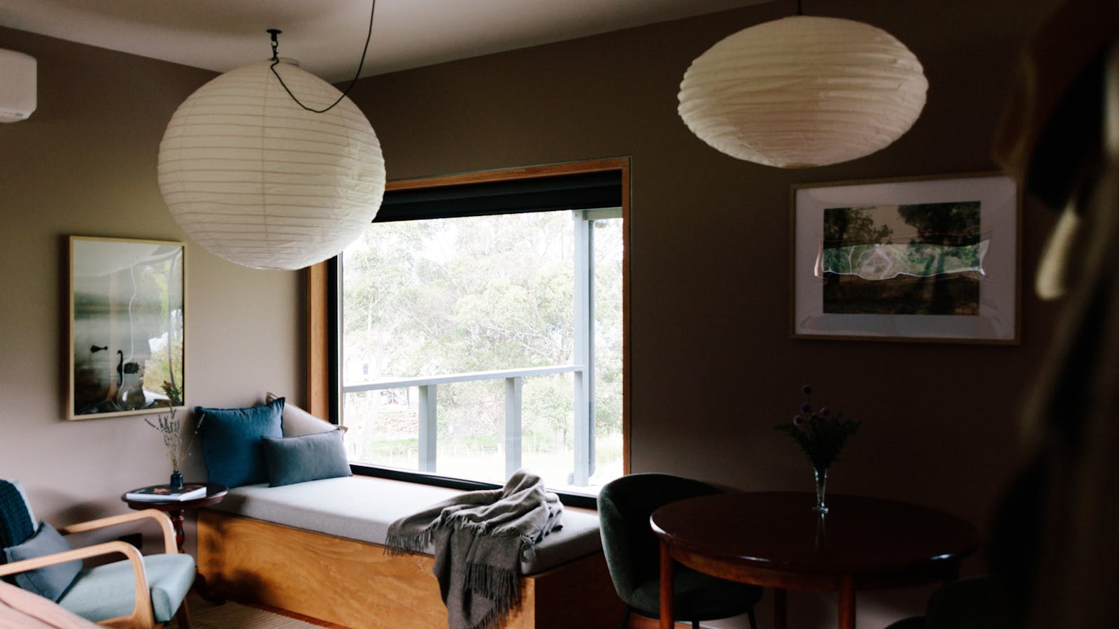 The window seat and occasional chair are perfect for reading and gazing at the river