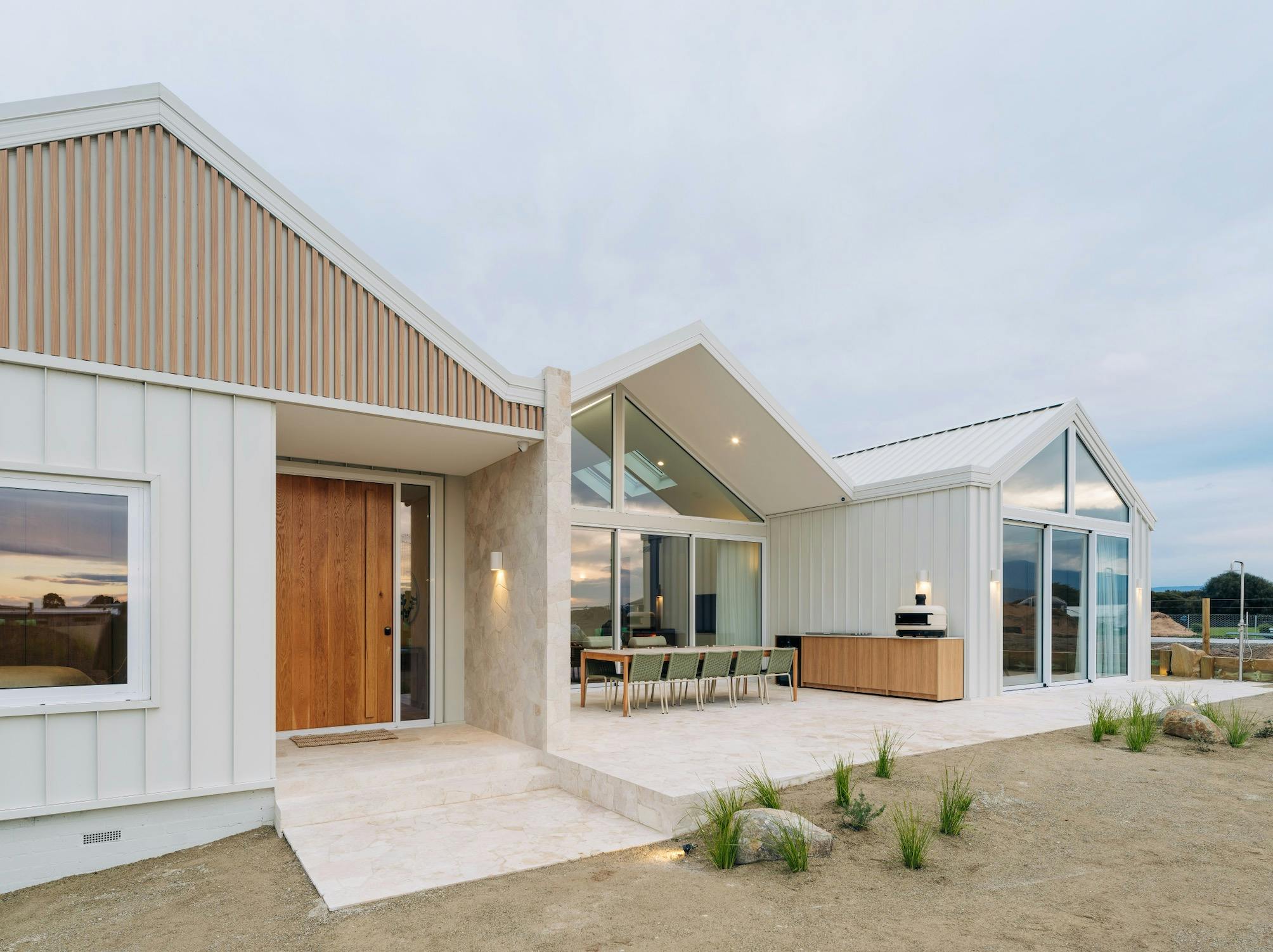 Front of house with alfresco area showing pizza oven, barbecue and seating for 10 people