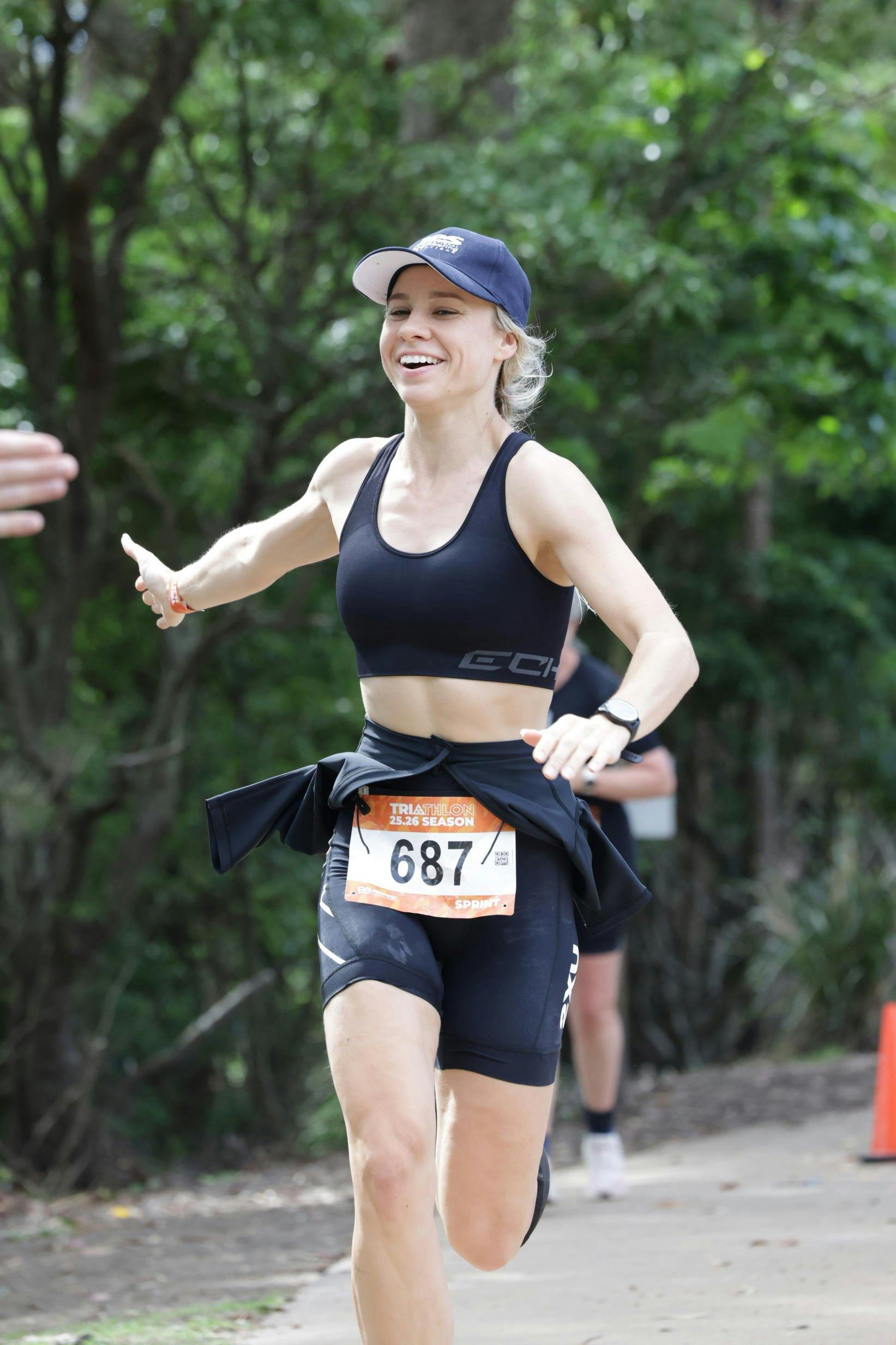 woman high five running