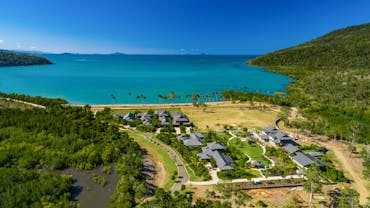 Yangaro from above - drone pic looking north over the 7 houses + Clubhouse, Funnel Bay background