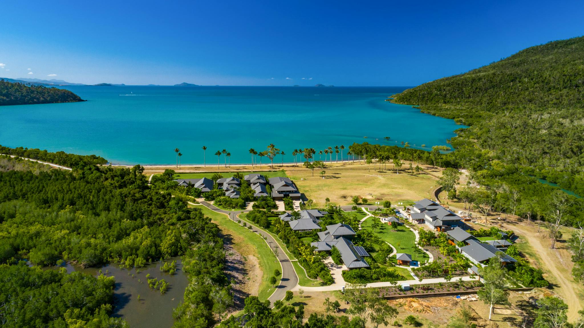 Yangaro from above - drone pic looking north over the 7 houses + Clubhouse, Funnel Bay background Yangaro from above - drone pic looking north over the 7 houses + Clubhouse, Funnel Bay background