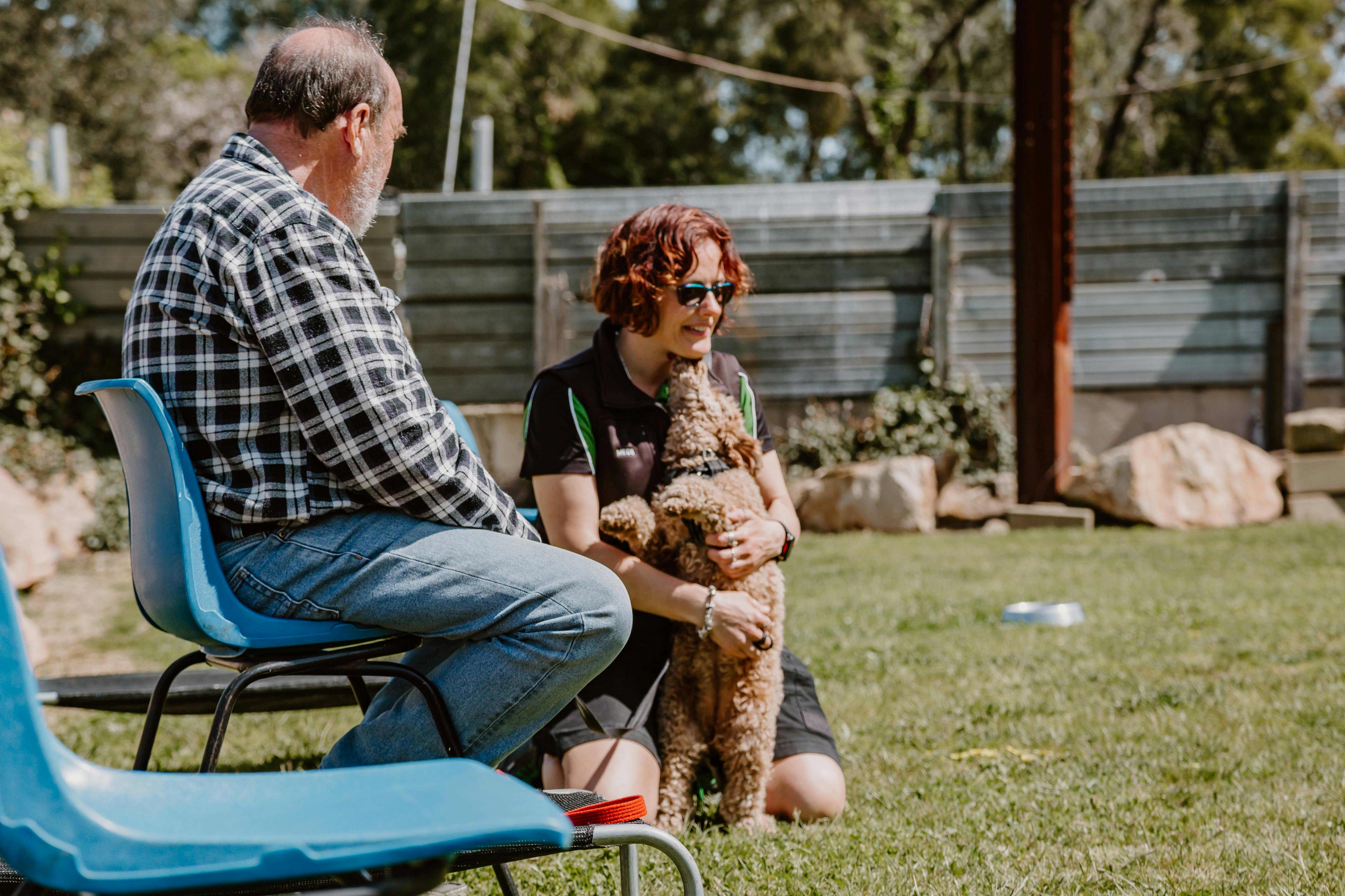 Dog hugging a person