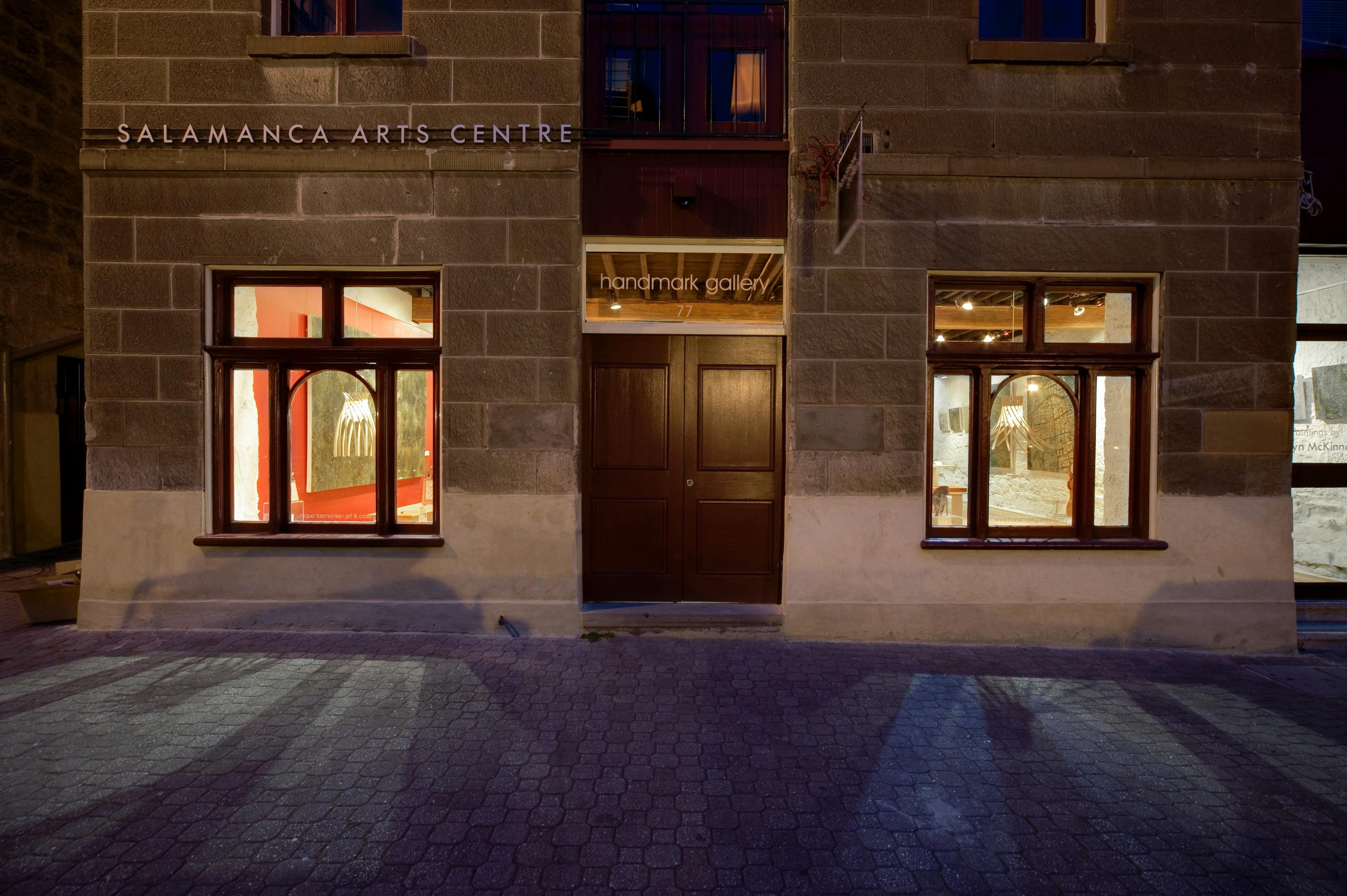 Image of Handmark Gallery exterior at night, viewed from Salamanca Place.