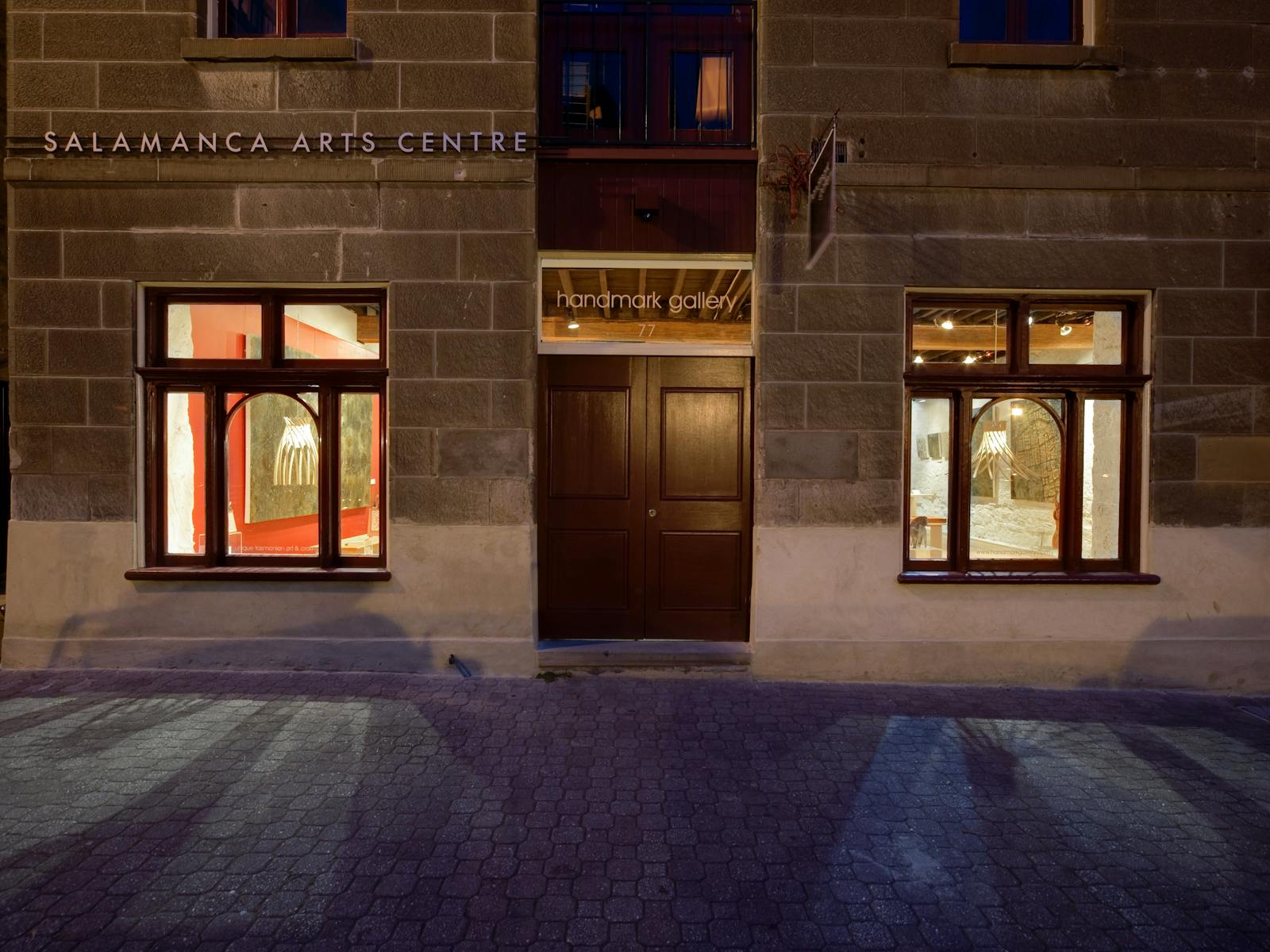 Image of Handmark Gallery exterior at night, viewed from Salamanca Place.