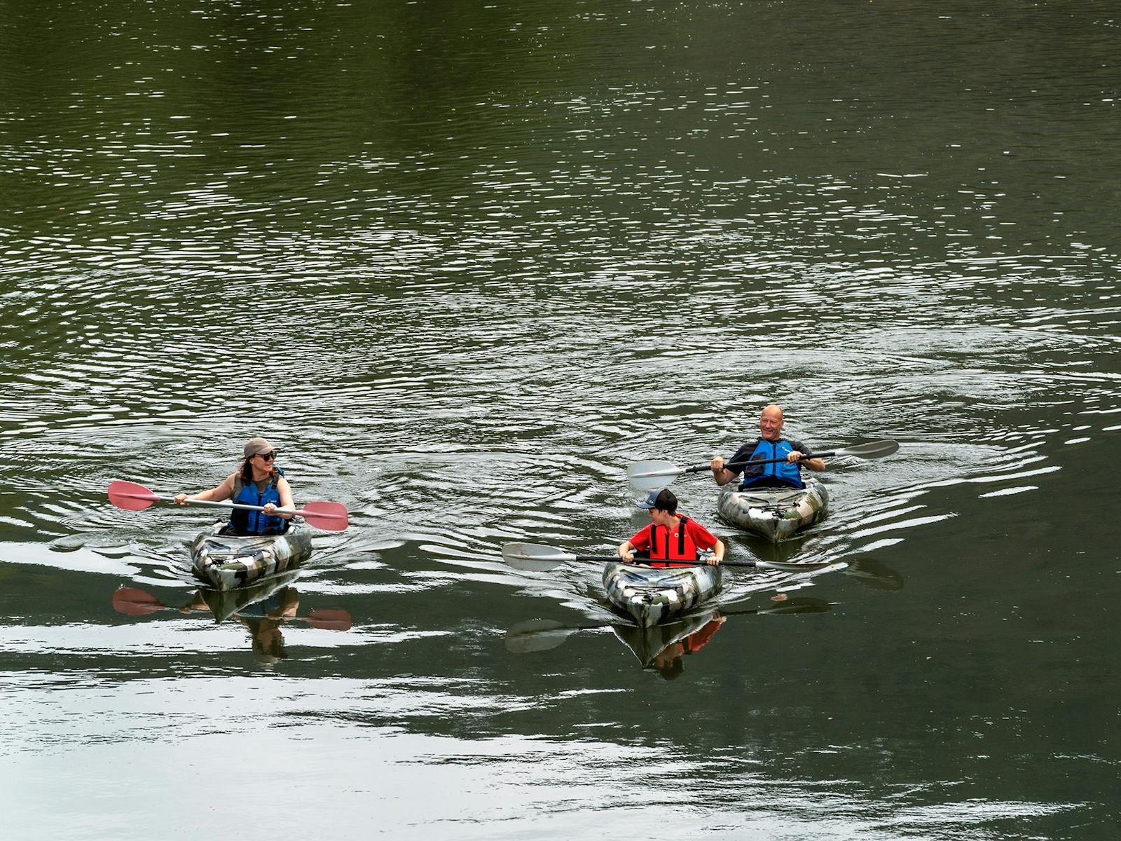 three kayakers on Jamieson River