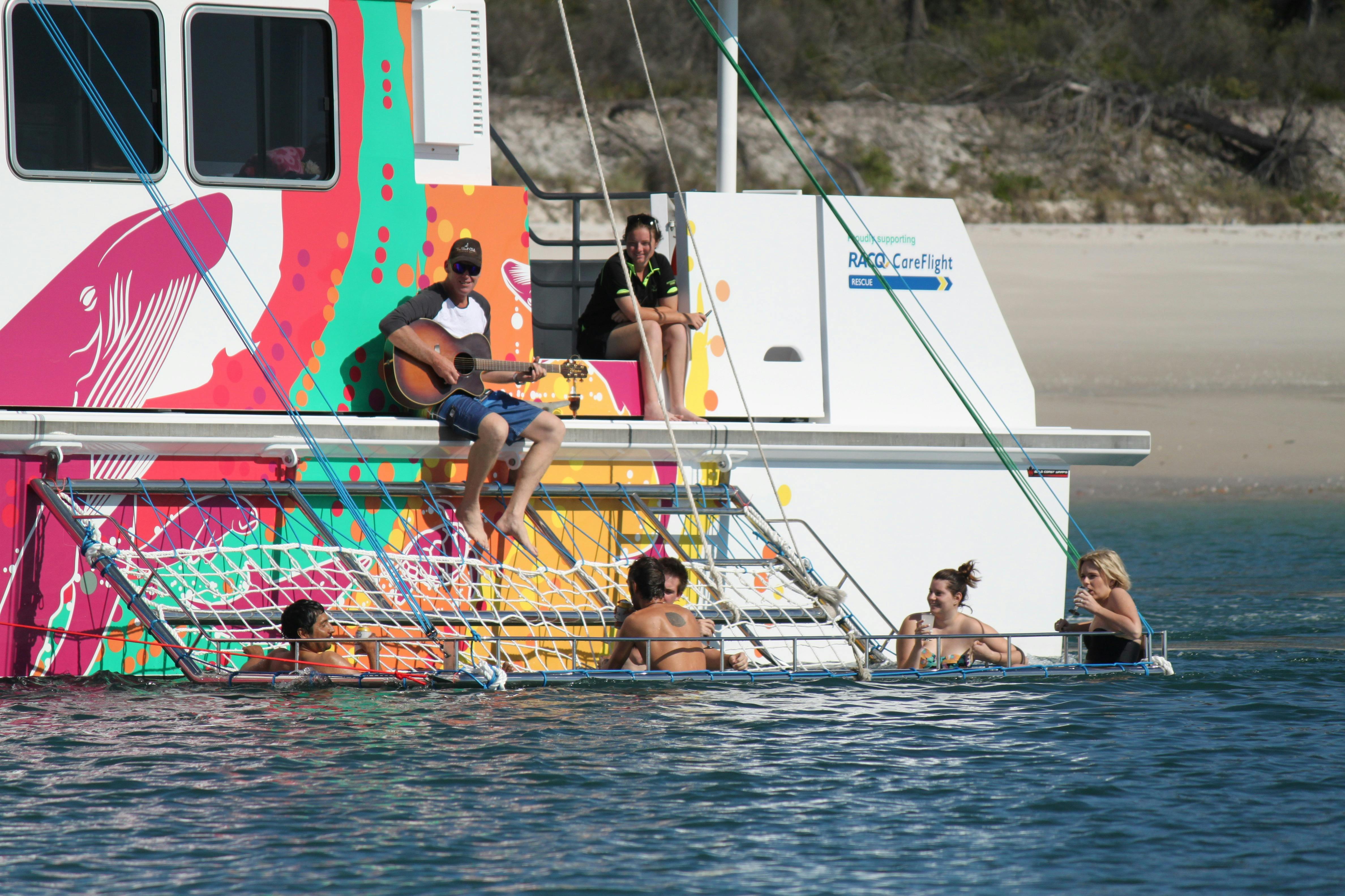 BOOMNET relax drink as we slowly cruise beside K'gari (Fraser) Island