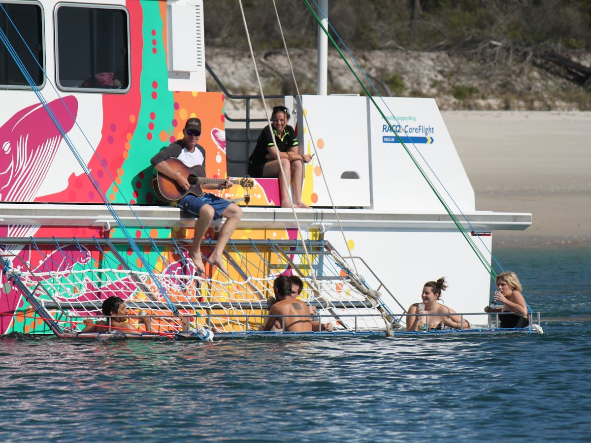BOOMNET relax drink as we slowly cruise beside K'gari (Fraser) Island
