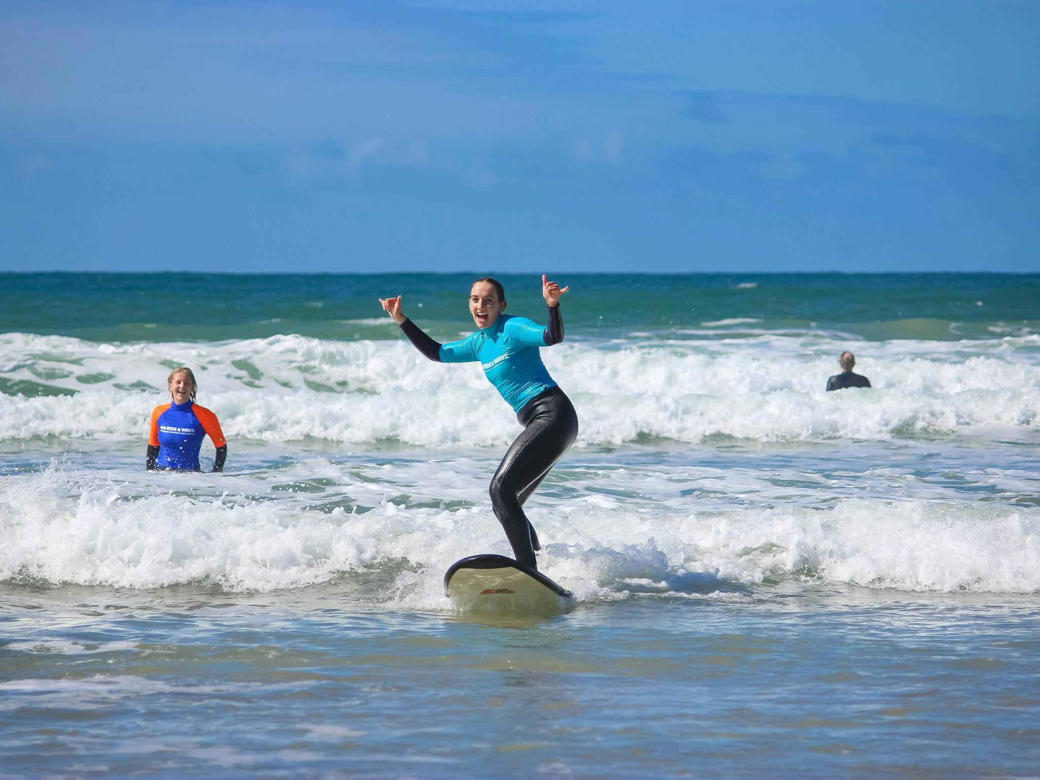 a female surfer on a surfboard in the water