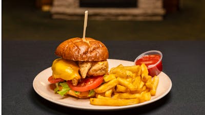 Buttermilk soaked chicken tenders, lettuce, tomato, cheese, tangy burger sauce on a pretzel bun