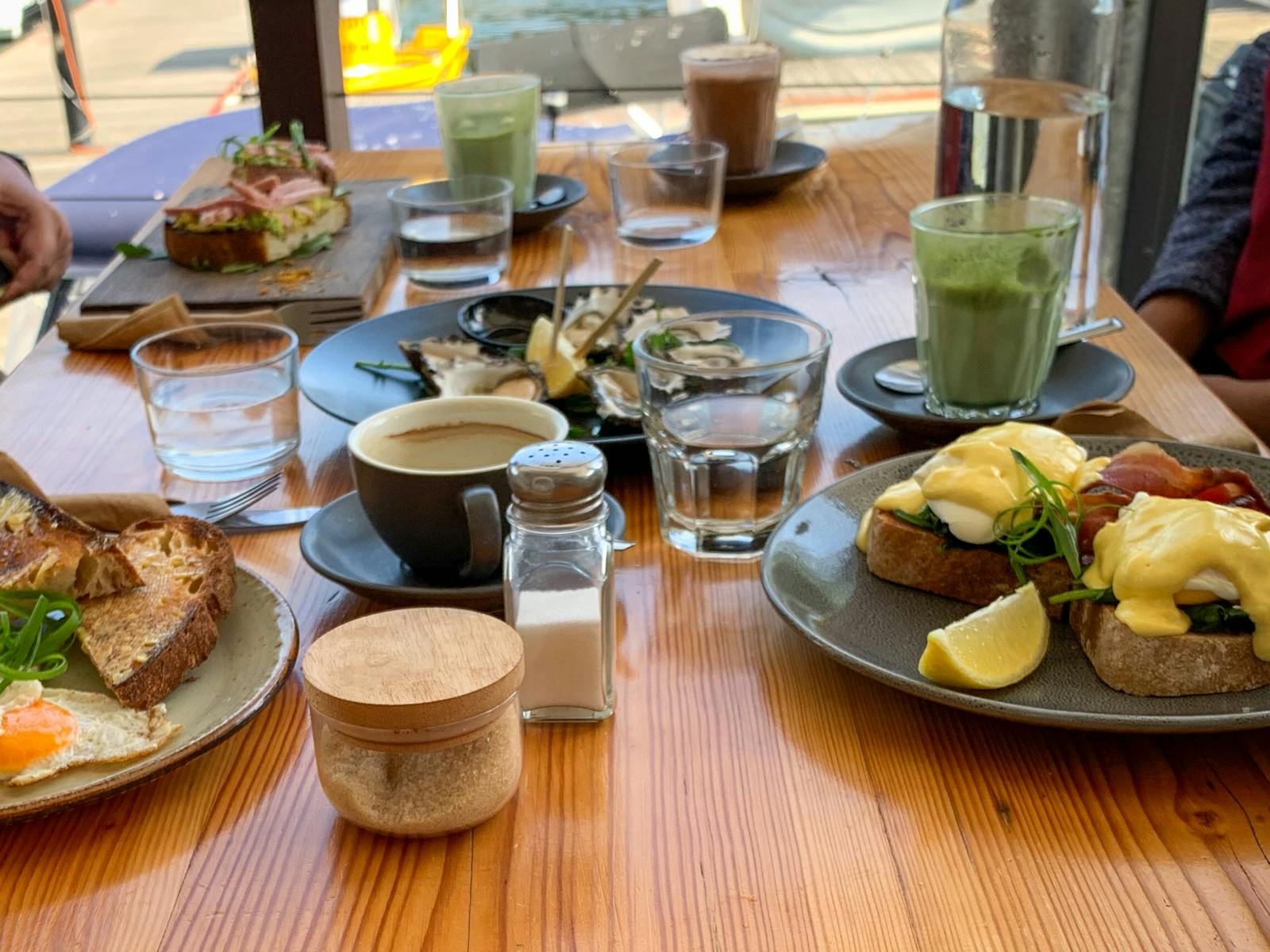 Breakfast table at Brooklyn with Sydney Rock Oysters, eggs and pancakes