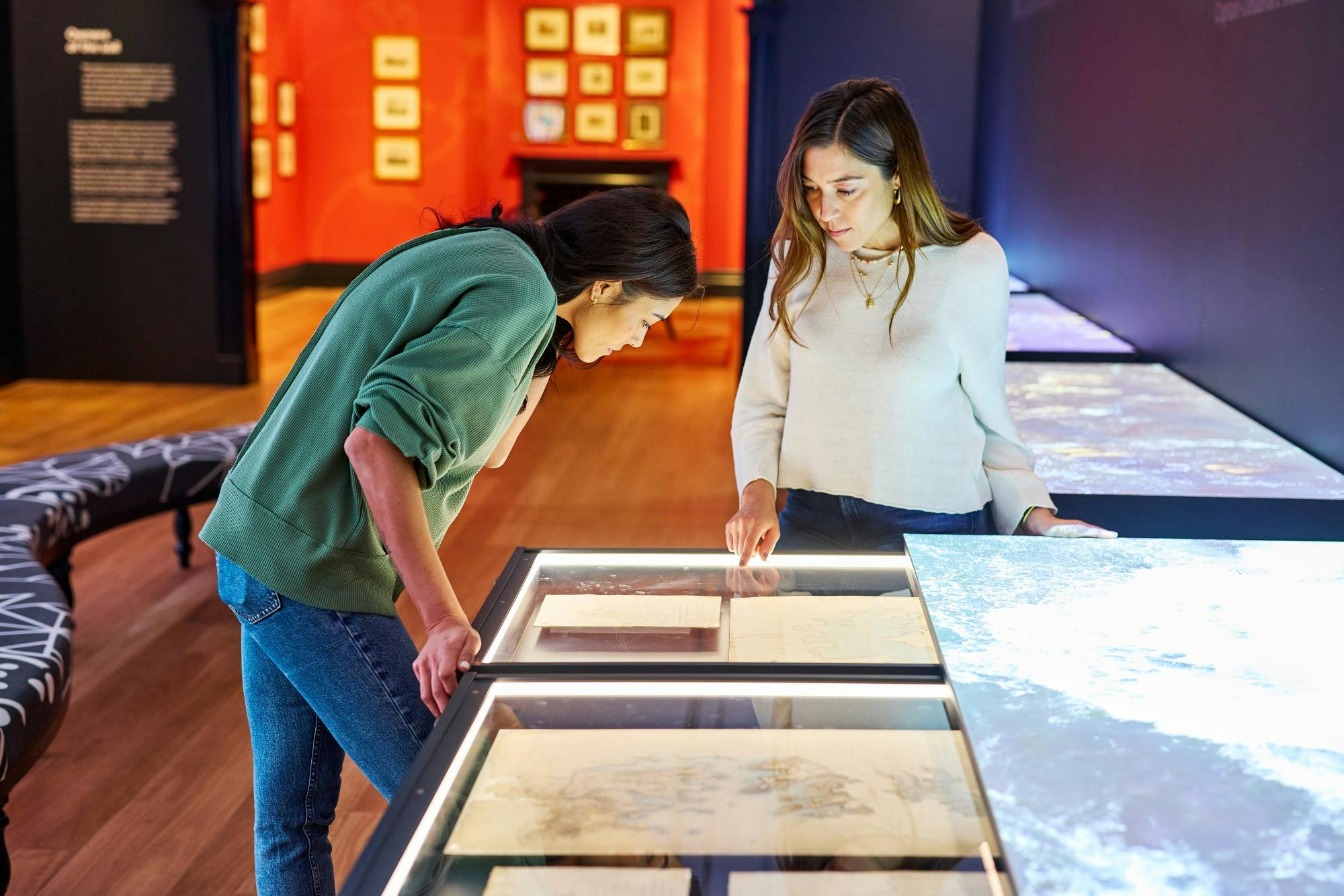 Visitors in the Seeing Sydney, Knowing Country exhibition.