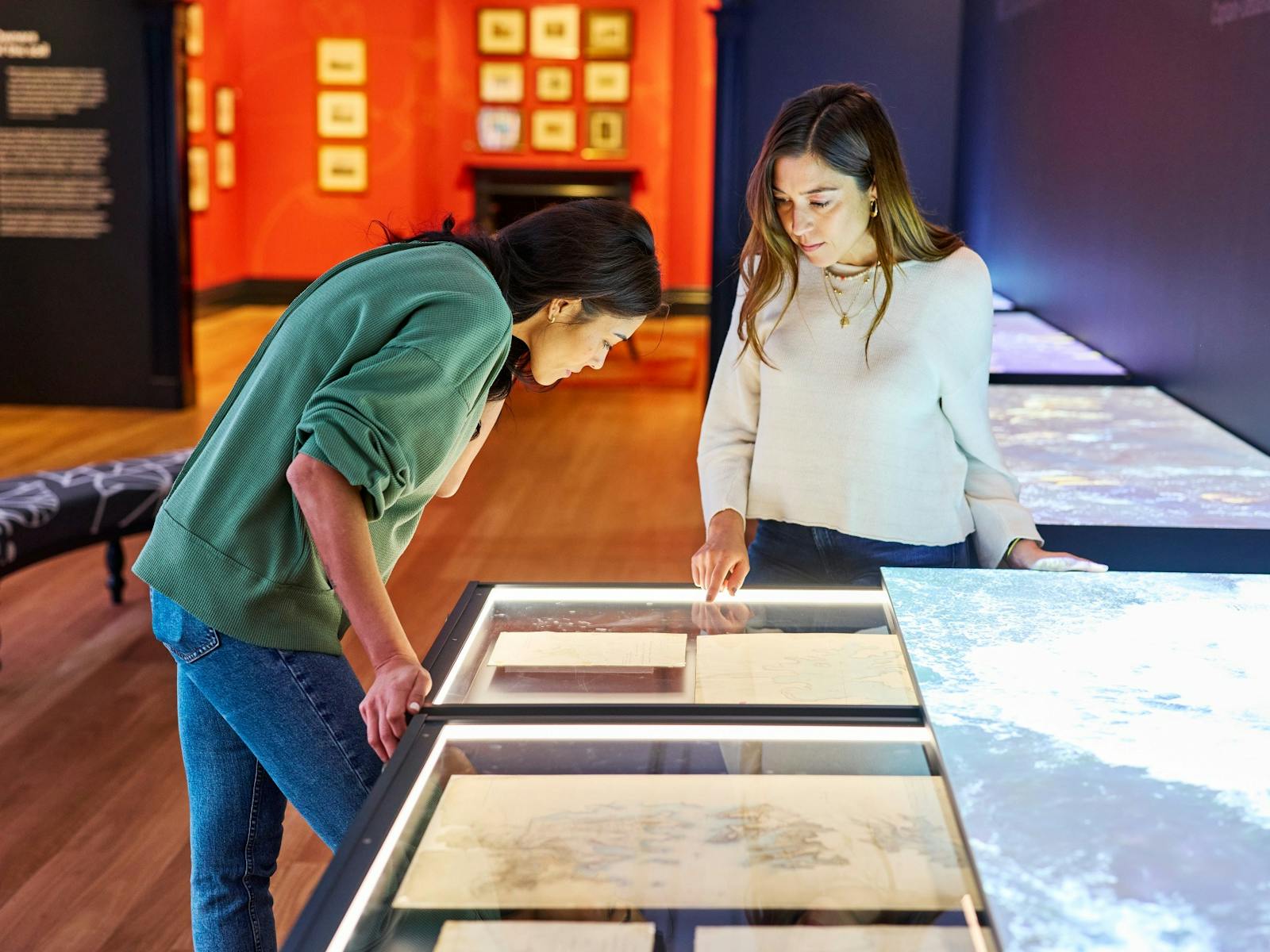 Visitors in the Seeing Sydney, Knowing Country exhibition.