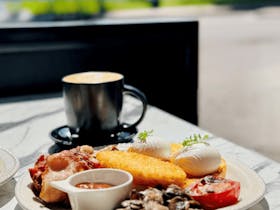 Full mixed grill breakfast with coffee