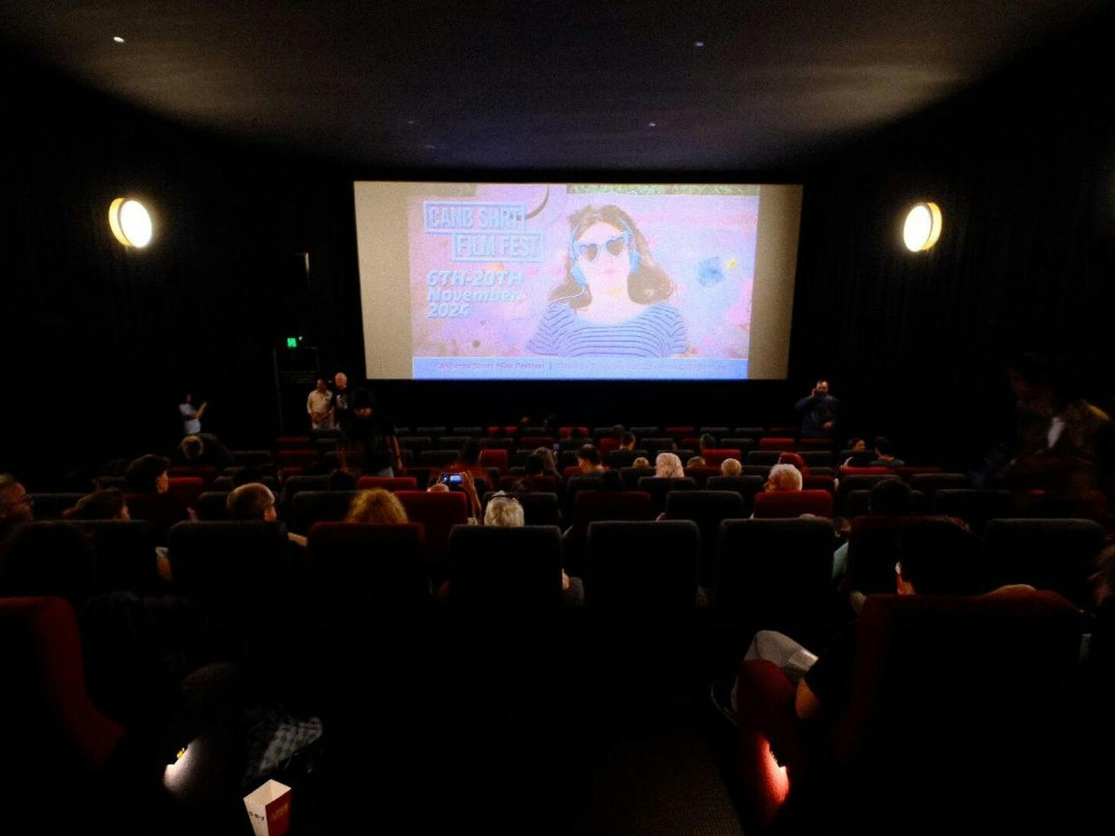 Screening of a CSFF Film in a Cinema with screen in the background and the audience in foreground