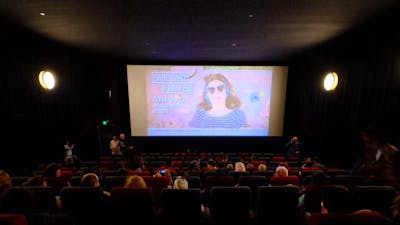 Screening of a CSFF Film in a Cinema with screen in the background and the audience in foreground