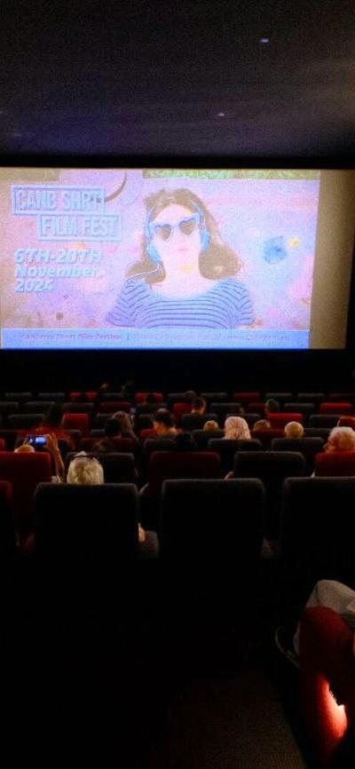Screening of a CSFF Film in a Cinema with screen in the background and the audience in foreground