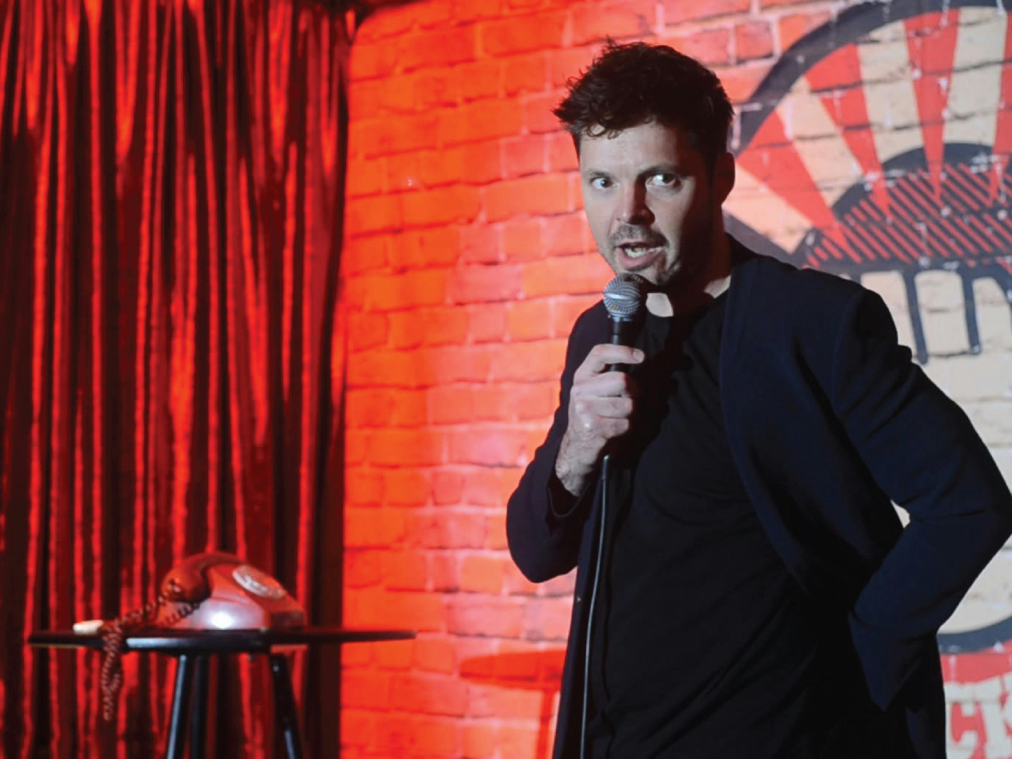 Student performing stand-up comedy