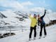 Two skiers posing for a happy photo on the slopes at Falls Creek