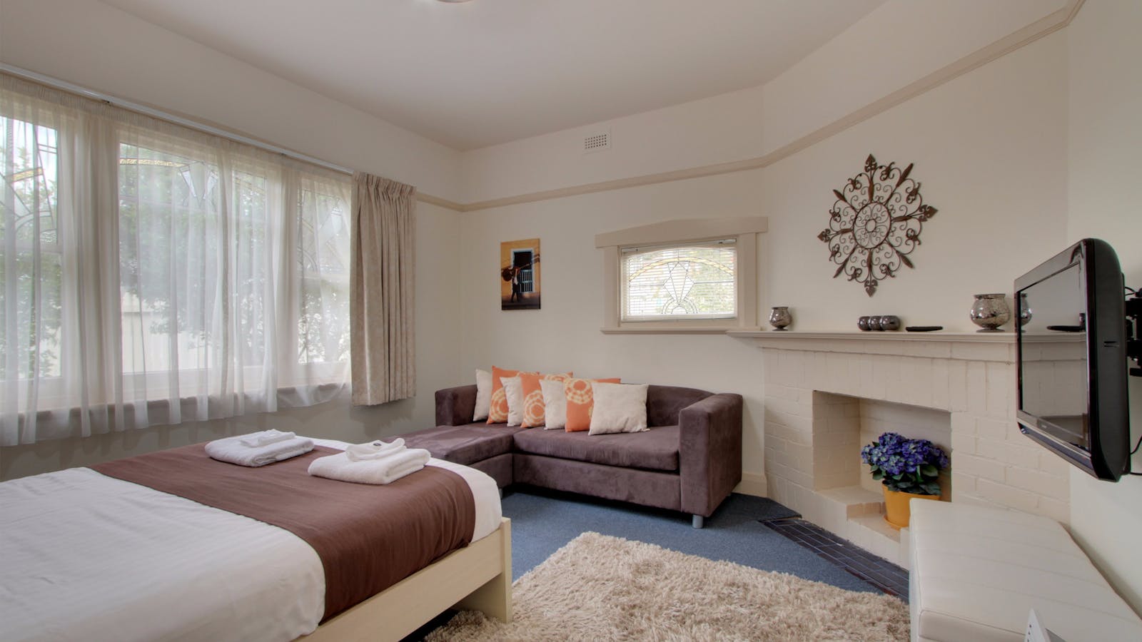 Spacious Master bedroom with chaise and TV