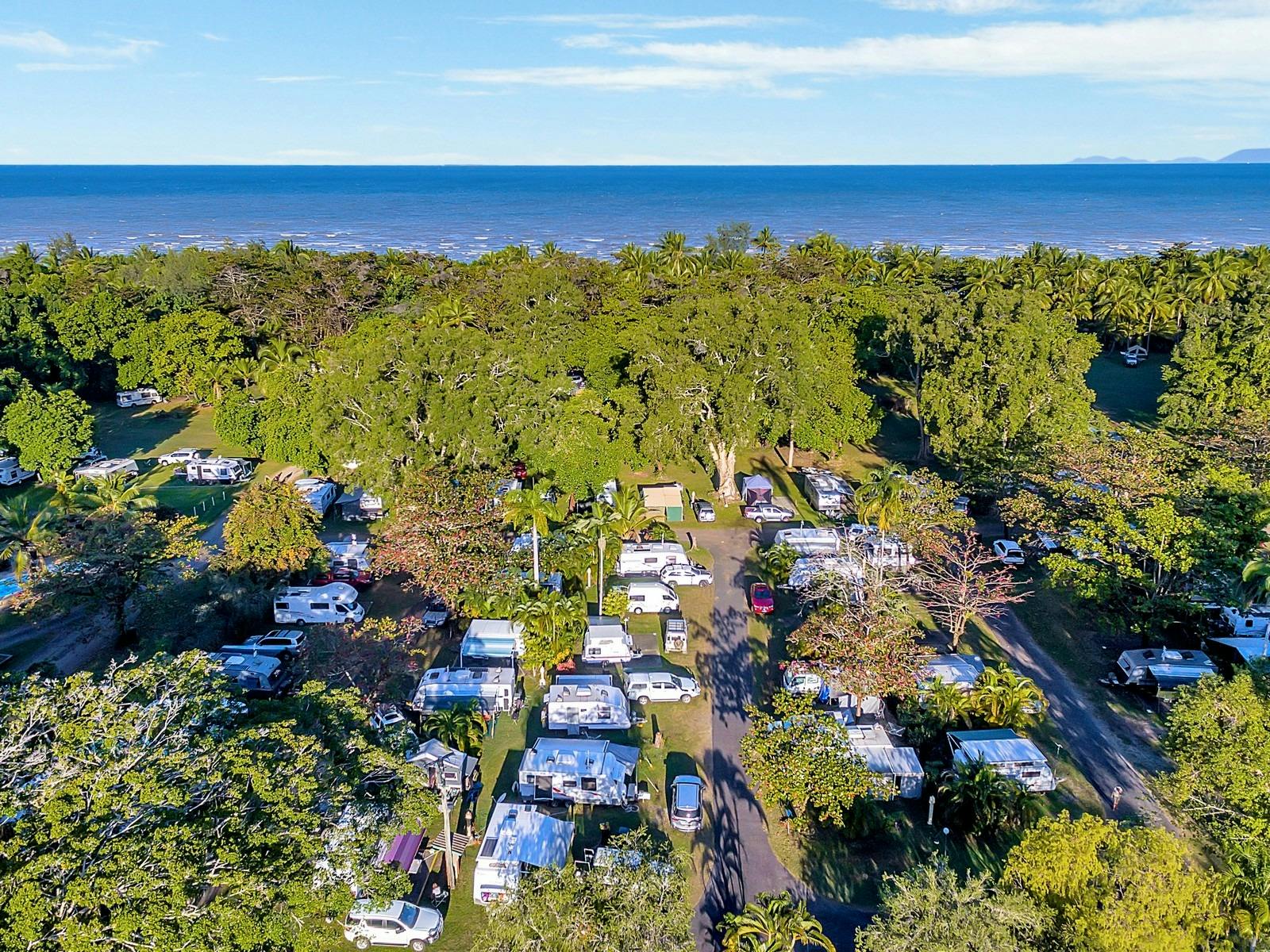 Image showing a full Resort with Caravans, Camping and Motorhomes from above. Beach in the distance Image showing a full Resort with Caravans, Camping and Motorhomes from above. Beach in the distance