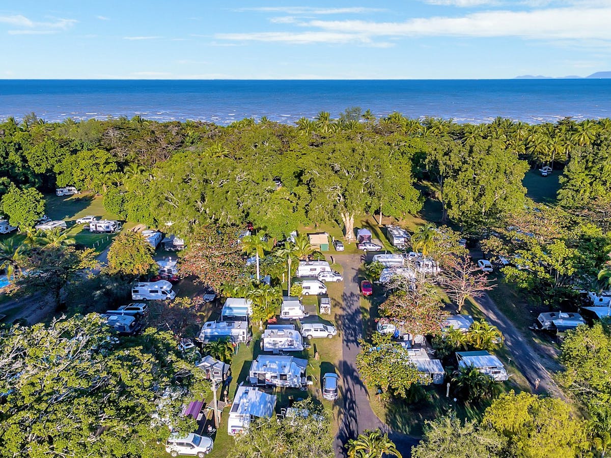 Image showing a full Resort with Caravans, Camping and Motorhomes from above. Beach in the distance