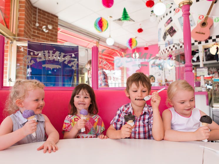 a group of children enjoy icecream