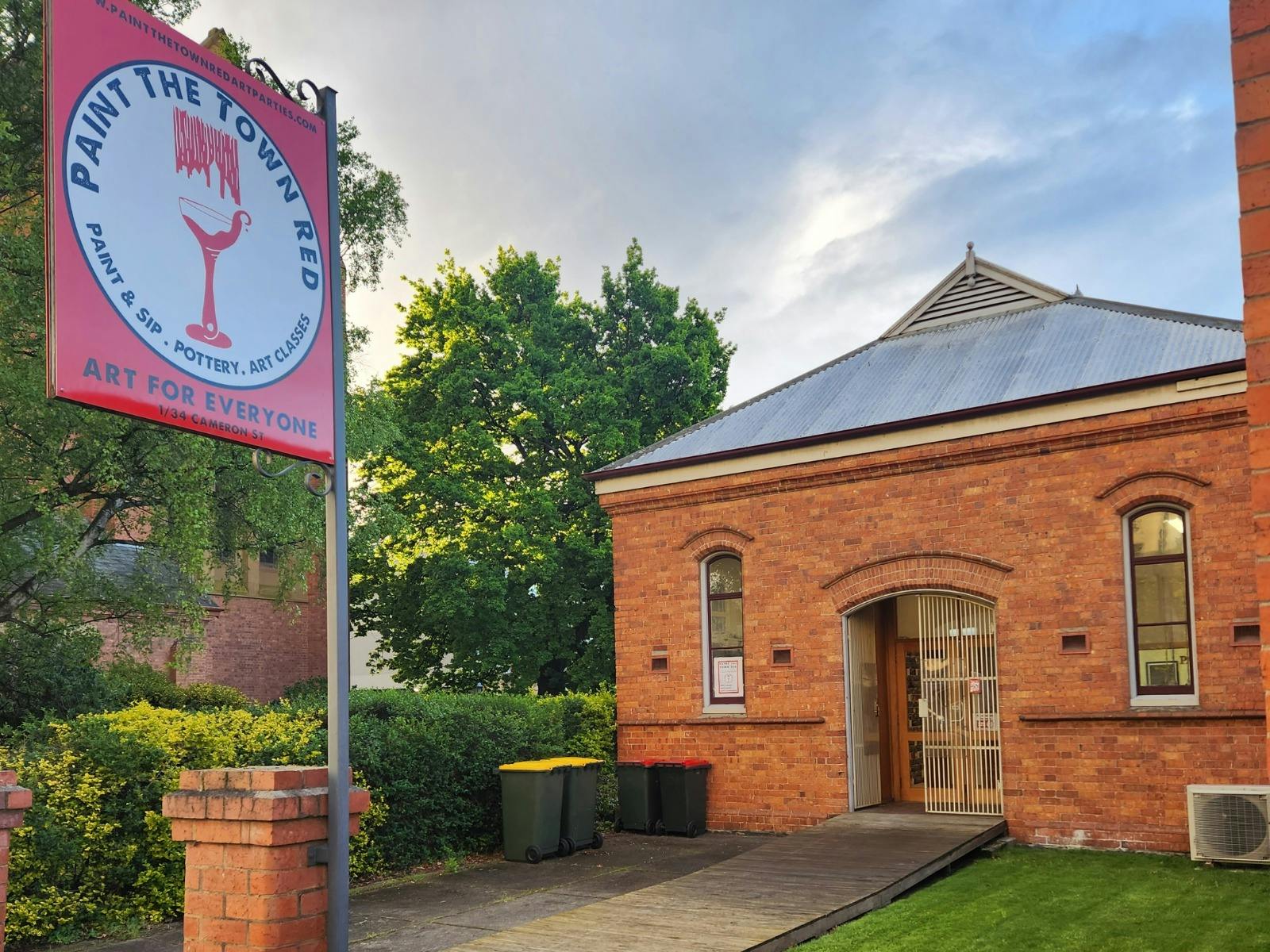 Paint the Town Reds sign and building