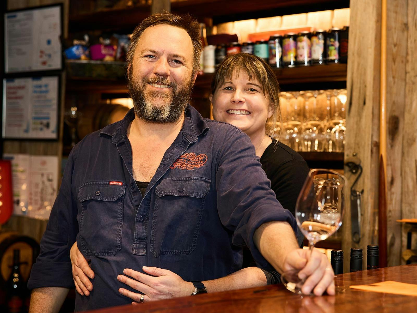 Hadyn and Lucy Black Behind the bar at the Black & Ginger Wine Shed