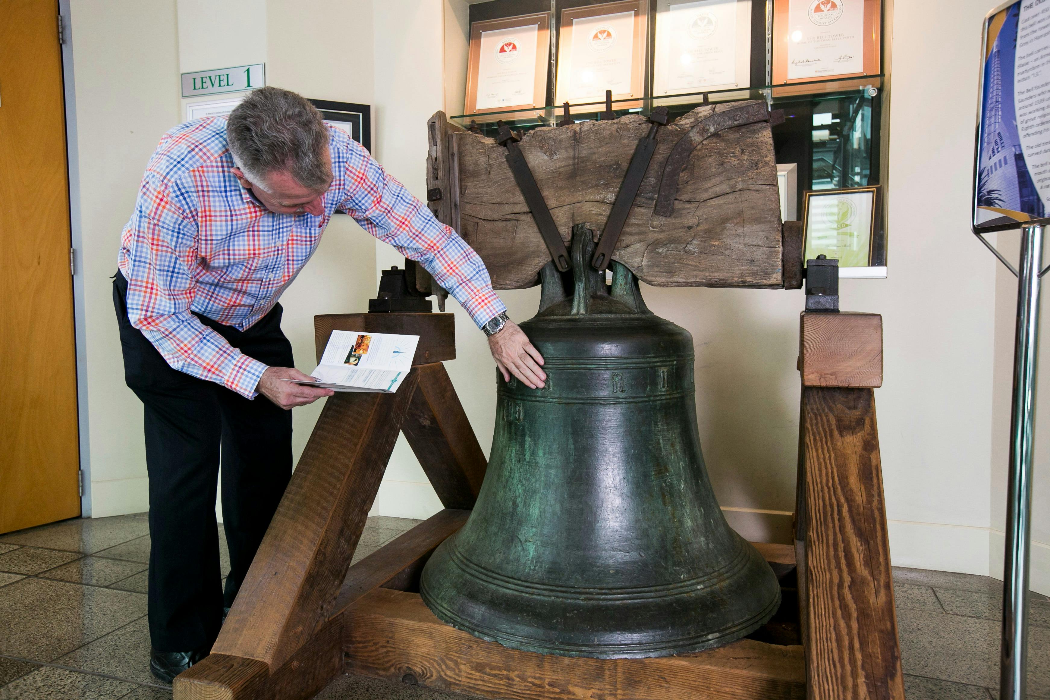 A guests rubs the oldest bell in Australia, located on level 1.