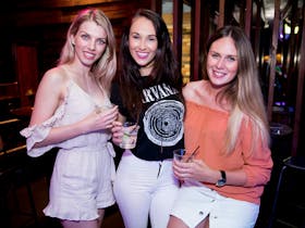 3 girls celebrating, on the pub club crawl. tour Gold Coast