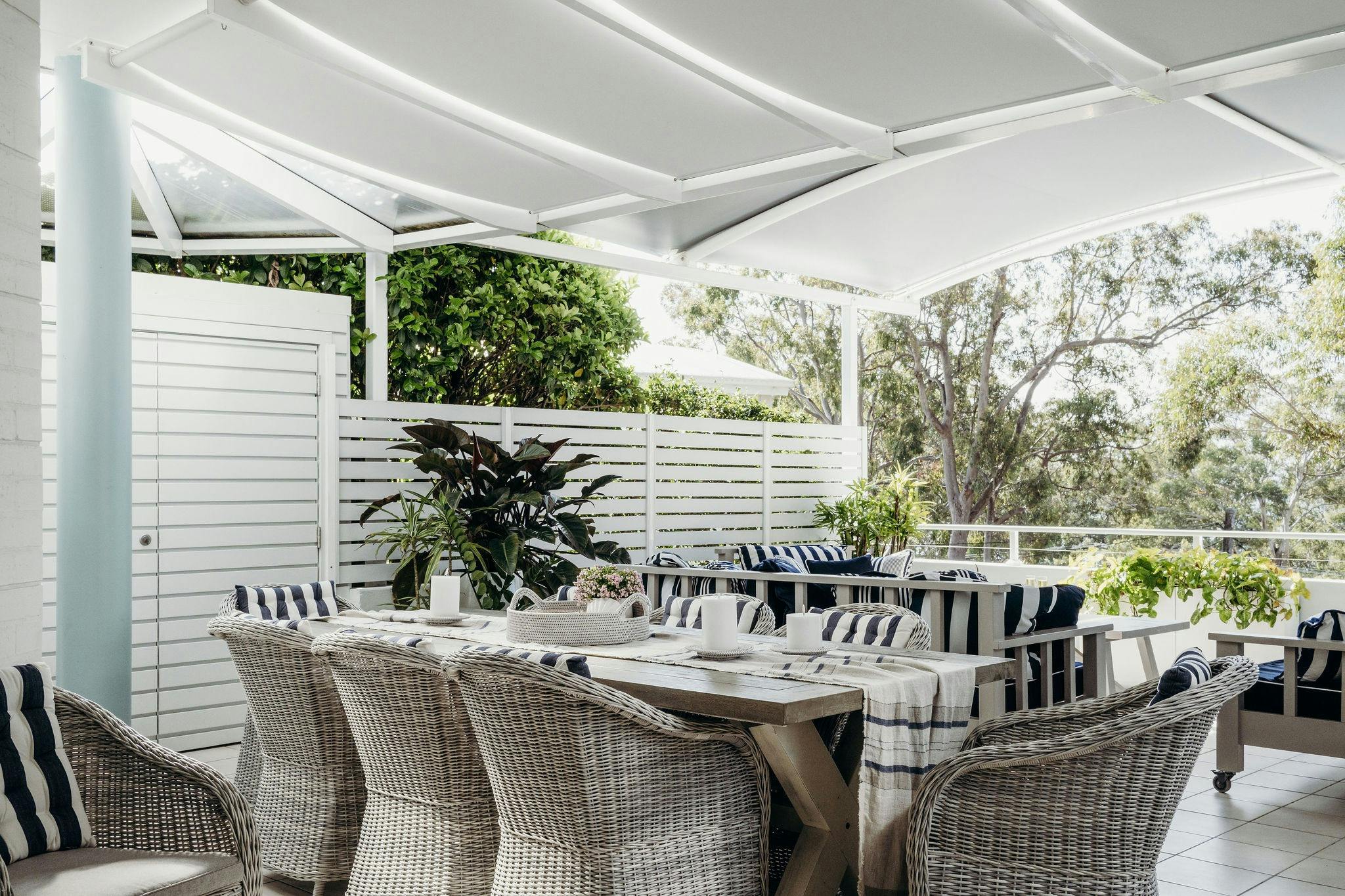 Covered veranda with outdoor dining and leafy Nelson Bay outlook