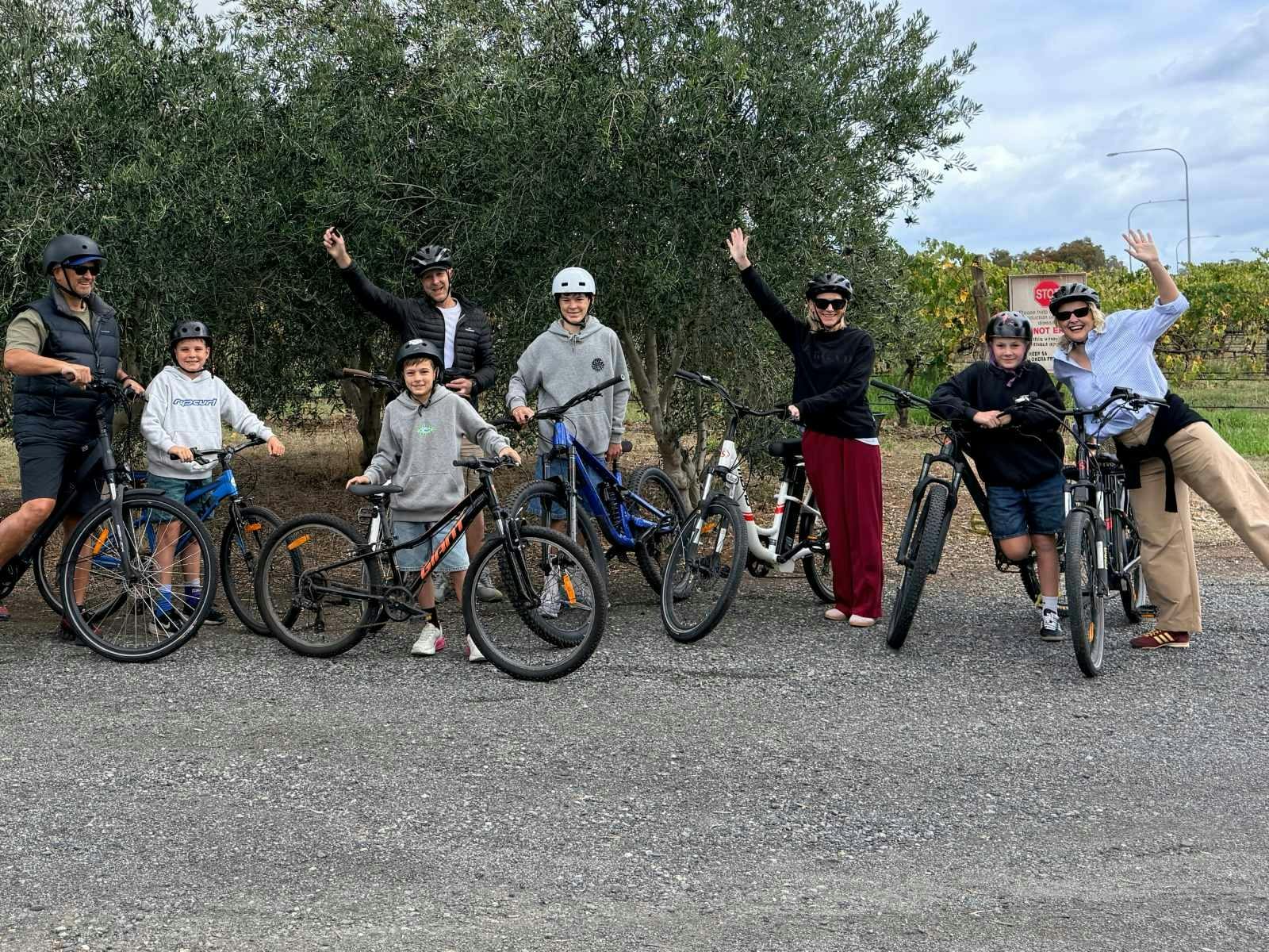Adults and boys standing with their bikes at SA eBikes hire hub at the McLaren Vale Visitor Centre