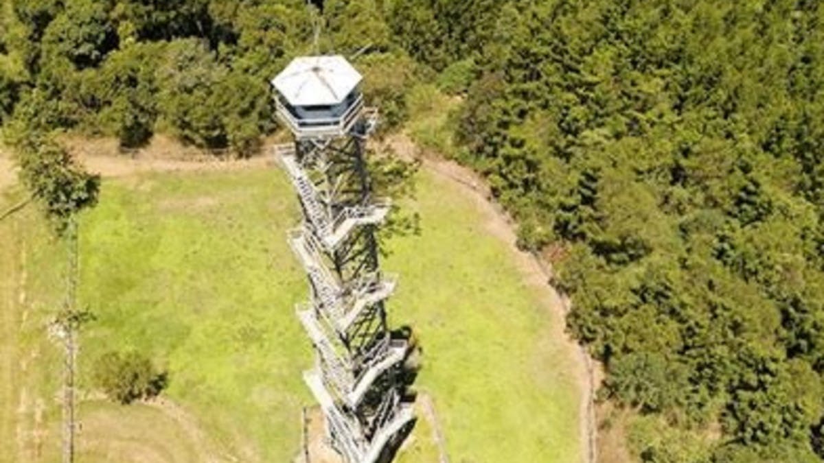 an aerial photo of the  Heritage listed Jimna Fire Tower. The tallest  timber pole fire tower